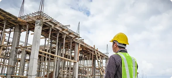 young-business-man-professional-engineer-worker-house-building-construction-site-with-blueprint